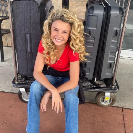 Mallory James Mahoney with her suitcase. 